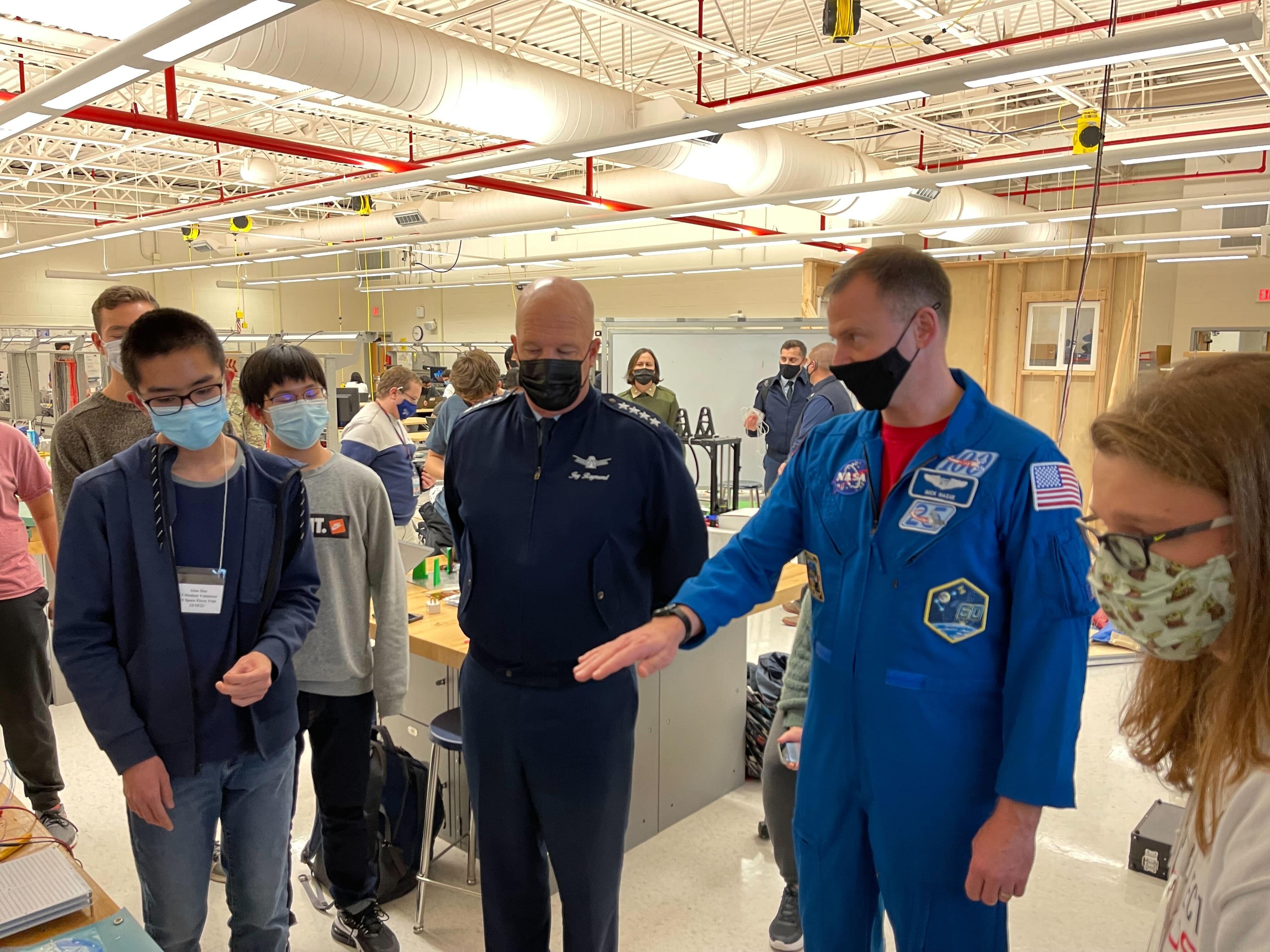 Me explaining the interface board and flatsat setup to Space Force Gen. Raymond and Col. Hague, when they visited the school in December